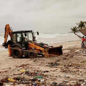 A piece of machinery being used to help clean up the beach