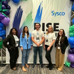 Five people standing together 