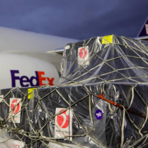 A large package outside a FedEx airplane