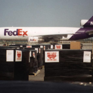Boxes of freight outside a FedEx airplane