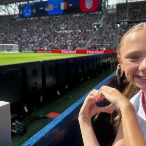 person in audience for soccer game