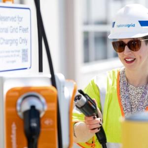 National Grid employee using an EV charger