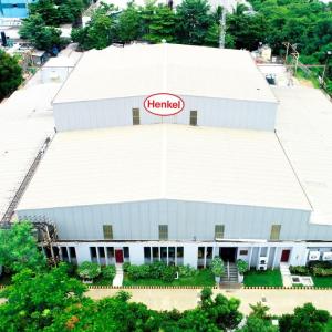Aerial view of  a large building with Henkel sign.