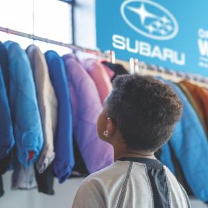 child looking at jackets