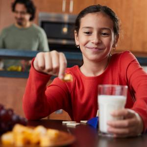 child with glass of milk
