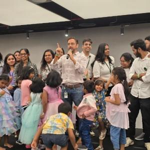 Employees and their children in an office