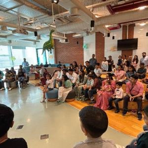 Employees and their children watching a presenter