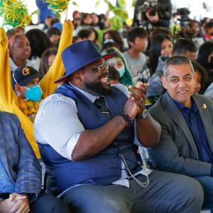 Rigo Topete, Area Vice President of Field Operations of Comcast California, DJ Criner, Pastor at Saint Rest Baptist Church, and Miguel Arias, Fresno City Council Member, at a Project UP event in Fresno with students from the community.