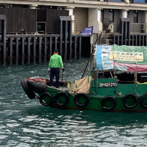 Clearbot (left) and small boat on a river
