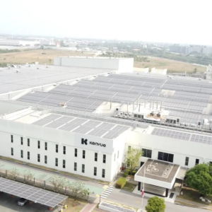 Aerial view of Kenvue building and parking lot showing solar panels