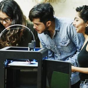 Young people working on a scientific project together