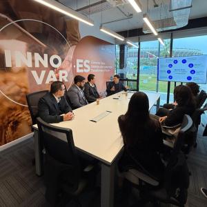 People seated at a conference table