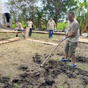 volunteers help build a garden