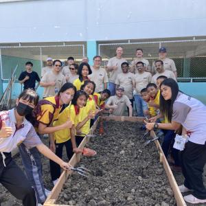 volunteers help build a garden