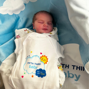 baby in an "I'm a Fifth Third Baby" onsie