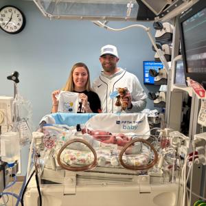 Baby and parents celebrating Fifth Third Baby