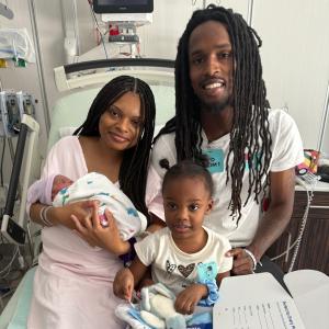 Baby and parents celebrating Fifth Third Baby