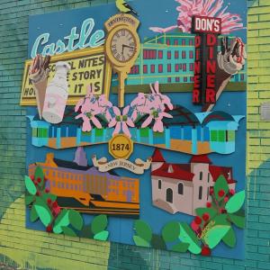 Brightly colored mural showing city landmarks
