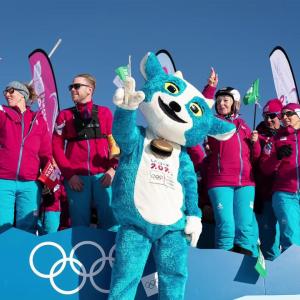 group of people in warm clothing with a mascot