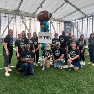 Volunteers posed in an indoor stadium