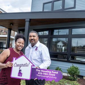 The Housing Fund President and CEO Marshall Crawford congratulates a first-time homebuyer in South Nashville.