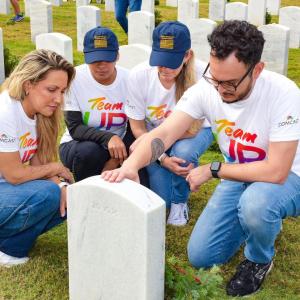 group next to headstone