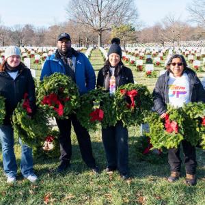 group standing with wreaths 