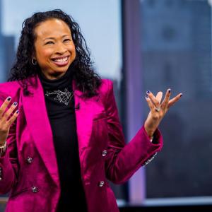Woman in pink blazer