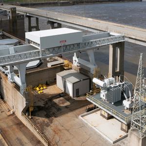 aerial view of an industrial overhead crane. a river in the background