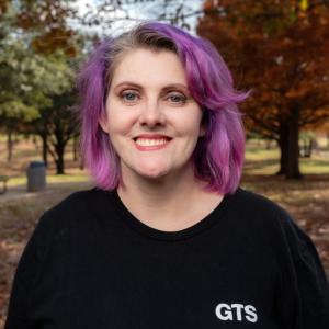 Portrait of Crystal Morris with trees in the background