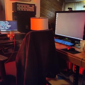 Desk with four monitors on