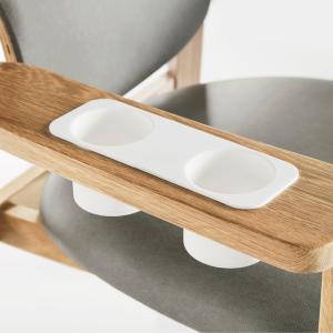 Close up of specialized nursing chair with two built-in cup holders