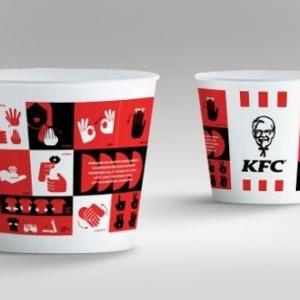 Two KFC cups with sign language on them.