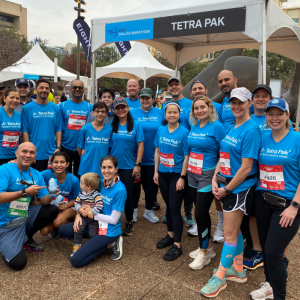 A posed group of runners and fans.