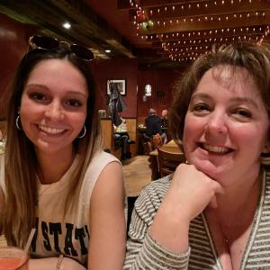 Scott's daughter and wife in a restaurant