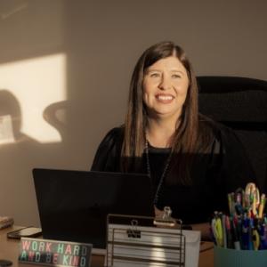 Martesi sat at a desk 