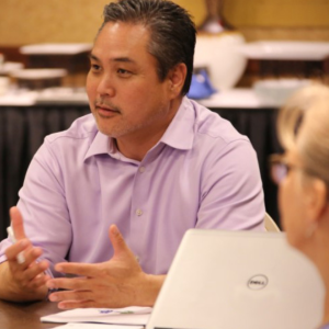 AAPI employee in a discussion