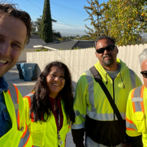 Group of four people in safety vests posed.