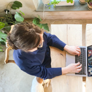 Woman sitting at a desk on video meeting