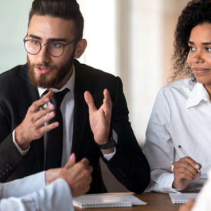 a group of four people sitting and talking