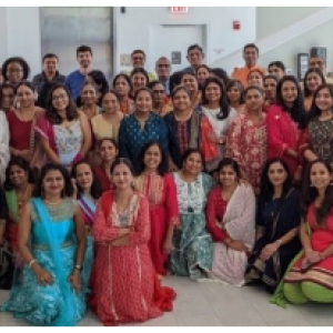 A group of people celebrating Diwali, posed for the camera.