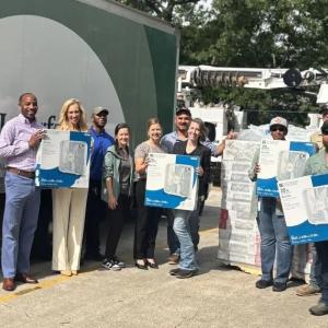 people holding up fans