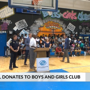 A gymnasium full of children and staff.