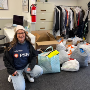 PSEG volunteer with bags of donated clothes