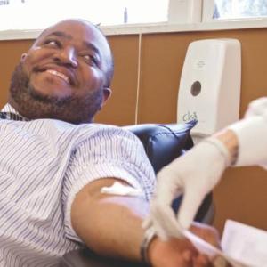 a person laying down, donating blood