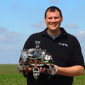 Inventor and engineer David Dorhout from Des Moines, Iowa with his little agri-crab robot.