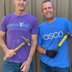 2 people hold hammers