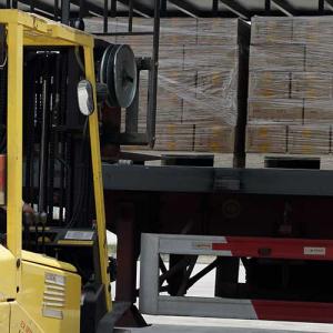 person driving a machine in a warehouse