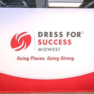 Wall with "Dress for Success Midwest Going Places. Going Strong." 