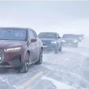 vehicles driving through snow
